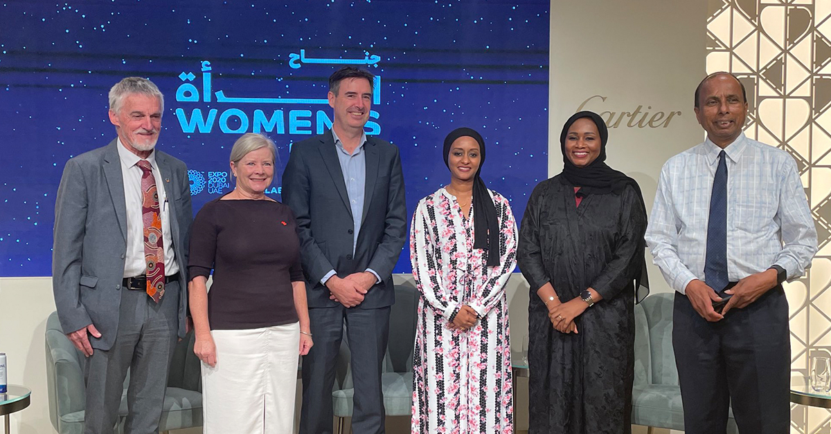 A group of men and women stand on stage, they presented at an event during Expo 2020 Dubai