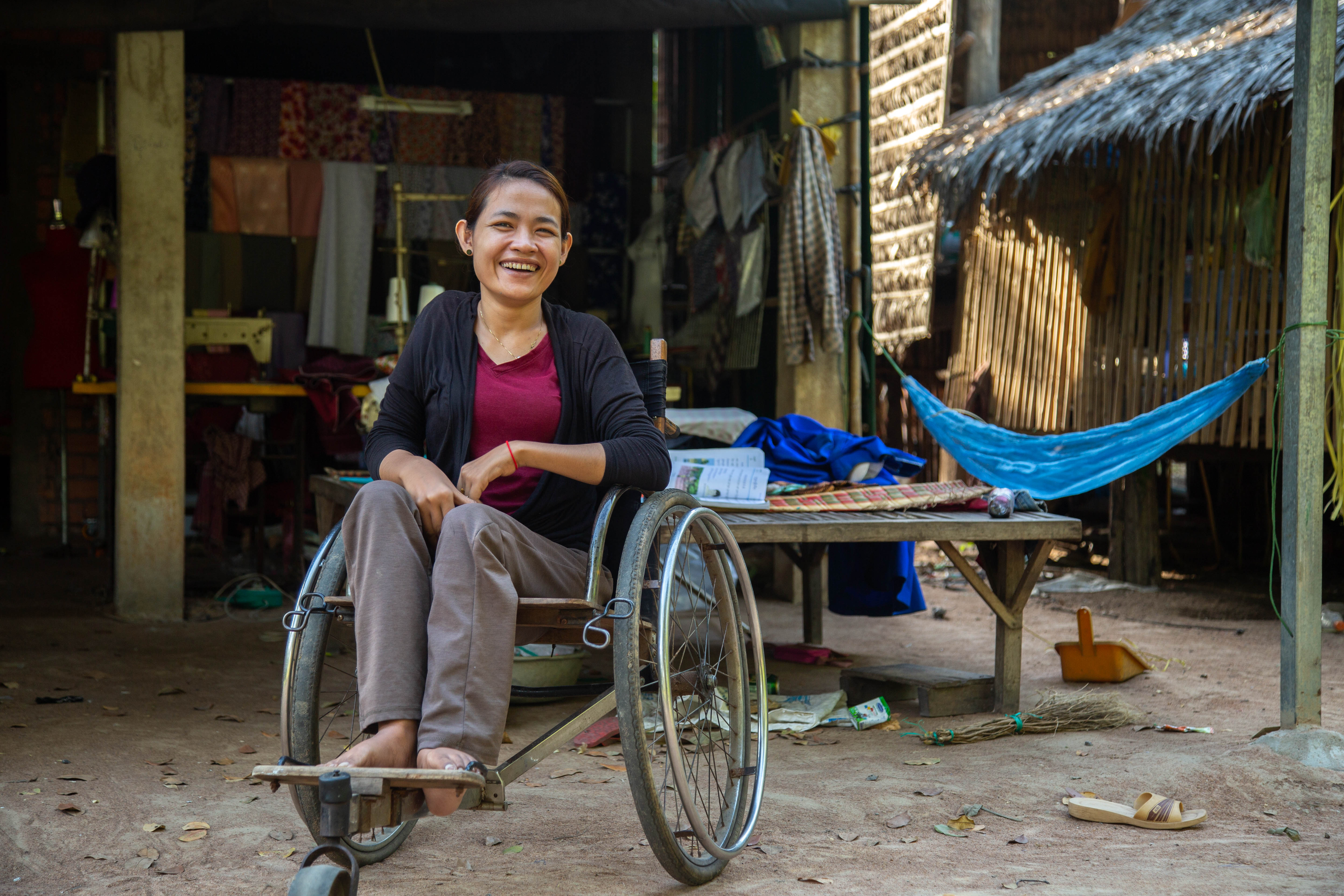 Navy, 29, smiles from her wheelchair in Kampong Tralach Province in Cambodia